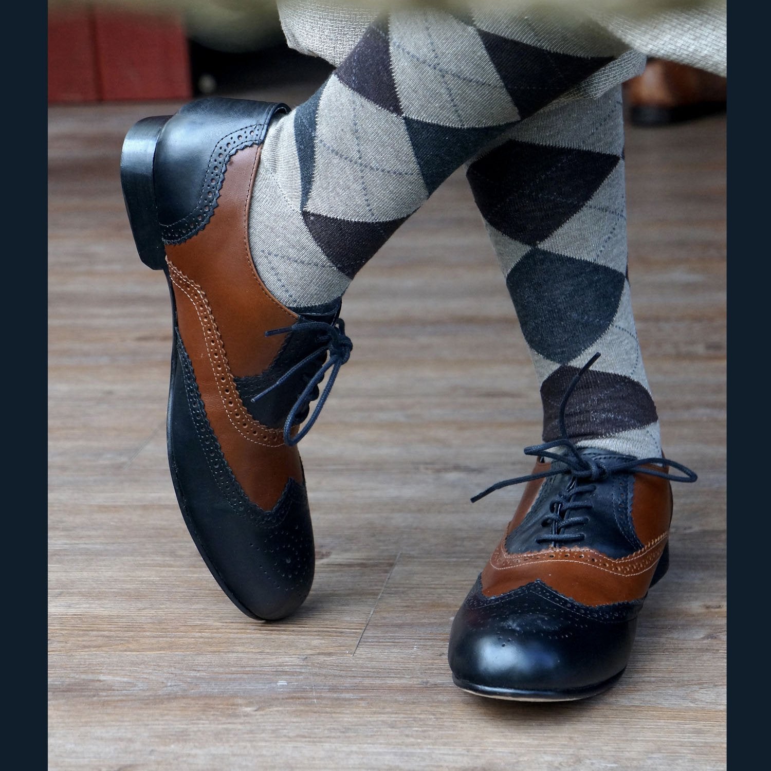 Men's black and brown wingtips and vintage socks